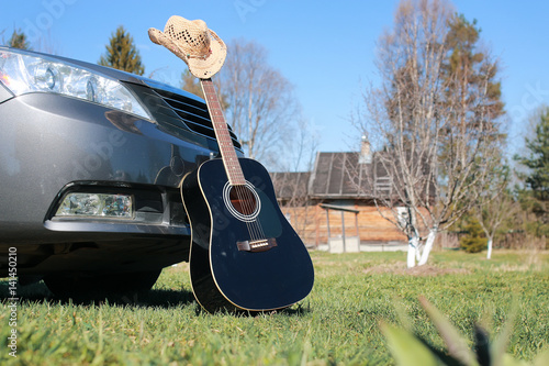 guitar outdoor near car photo