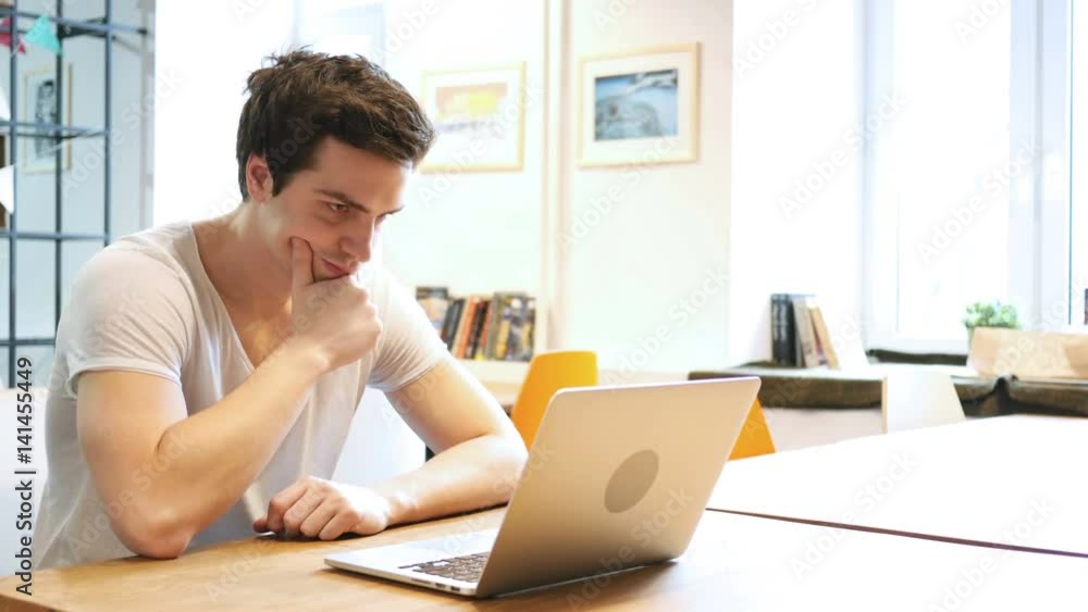 Thinking Designer working on Laptop Thinking Designer working on Laptop