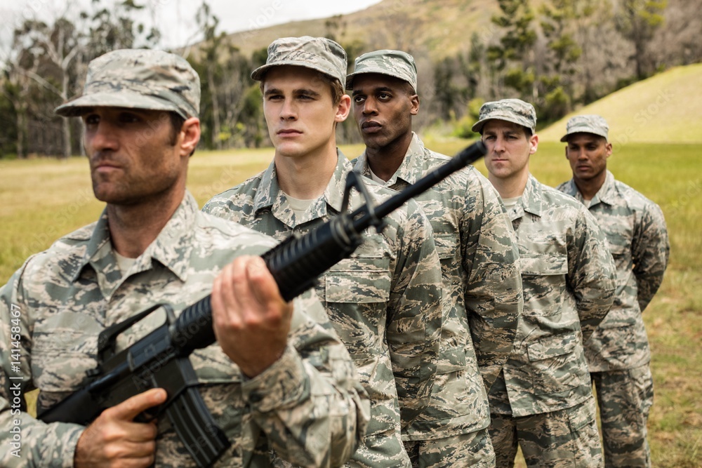 Group of military soldiers standing in line Group of military soldiers standing in line