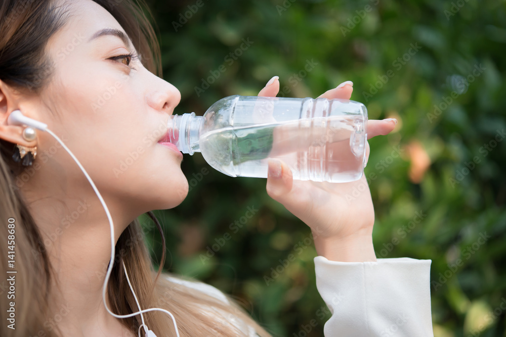 Beautiful business woman drinking water after hard work Beautiful business woman drinking water after hard work