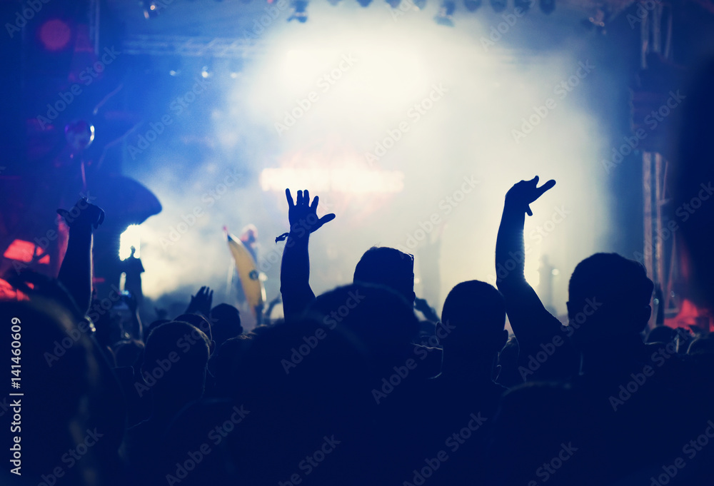 Crowd with arms outstretched at concert Crowd with arms outstretched at concert