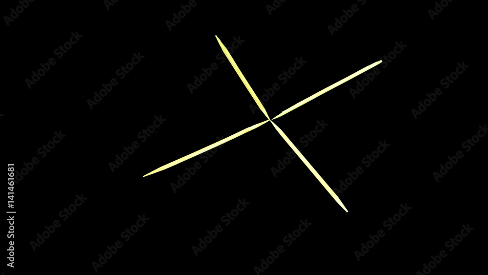 The letter made by toothsticks on black background The letter made by toothsticks on black background