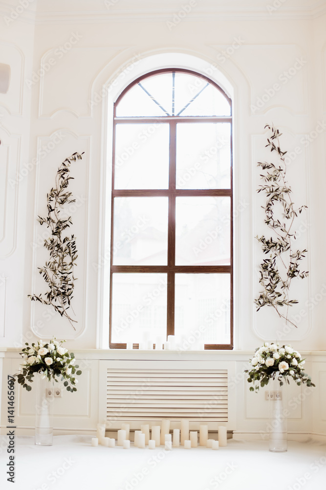 beautiful decoration with flowers near the window beautiful decoration with flowers near the window