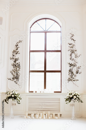 beautiful decoration with flowers near the window