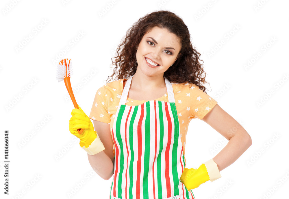 Smiling young woman holding tools for cleaning house on white background. Cleaning concept. Housekeeper isolated portrait. Smiling young woman holding tools for cleaning house on white background. Cleaning concept. Housekeeper isolated portrait.