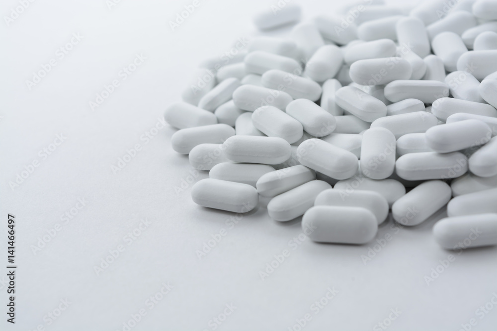 pills on white background.