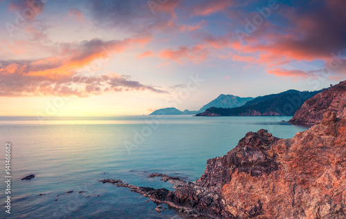 Few minutes before the sunrise on the Mediterranean sea in April. Colorful morning scene in the small bay near Tekirova village © Andrew Mayovskyy