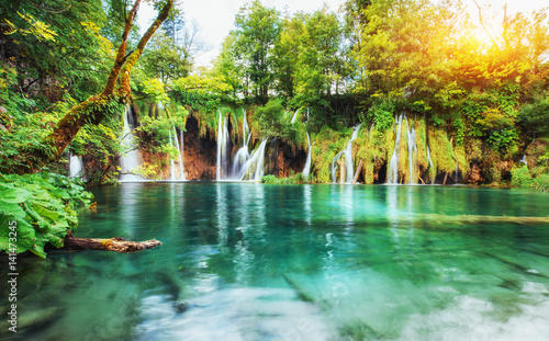 Waterfalls in national park falling into turquoise lake. Plitvice, Croatia © standret