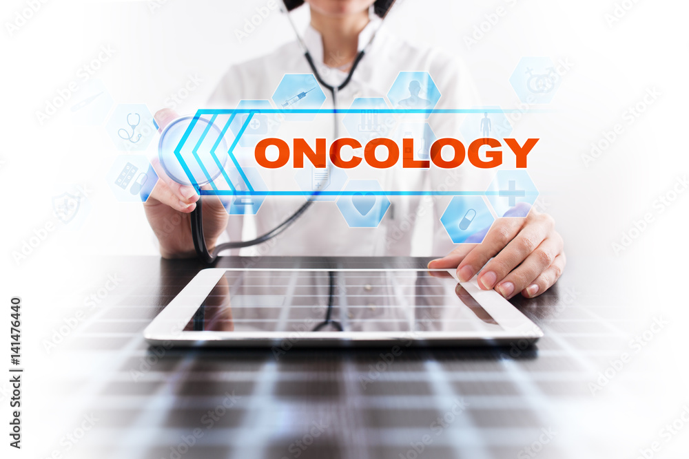 Medical doctor using tablet PC with oncology medical concept.