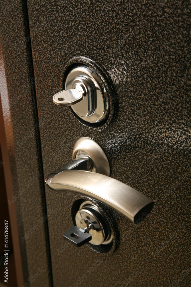 The handle on the metal safe door The handle on the metal safe door