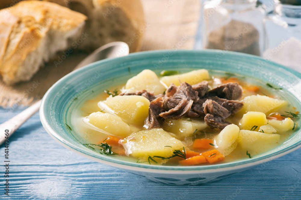 Potato soup with beef on wooden background. Potato soup with beef on wooden background.