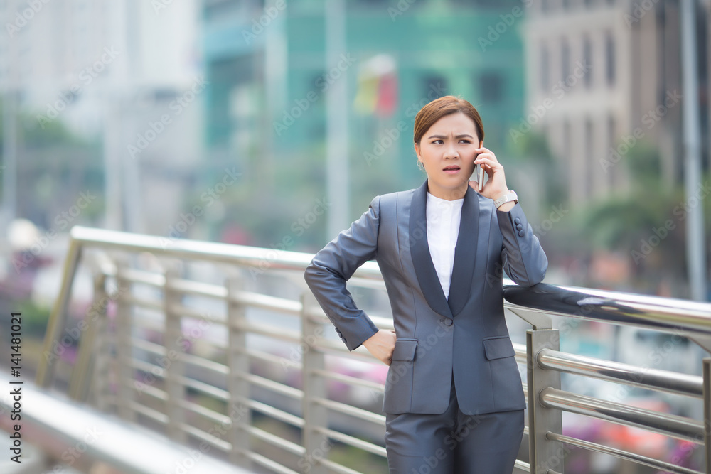 Woman calling the smartphone and she feel angry Woman calling the smartphone and she feel angry