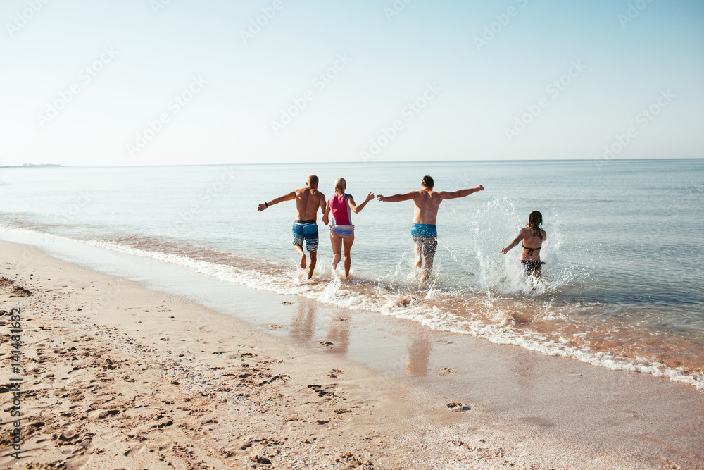 Friends on the beach. Have fun at sunny summer day