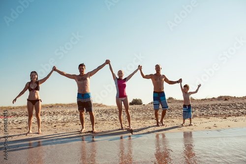 Friends on the beach. Have fun at sunny summer day