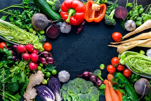 Fototapeta Naklejka Na Ścianę i Meble -  Big set organic food. Fresh raw vegetables. On a black chalkboard.