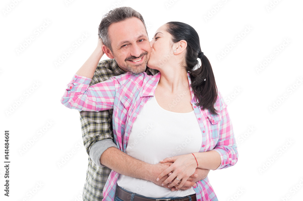 Young loving couple with female kissing her man