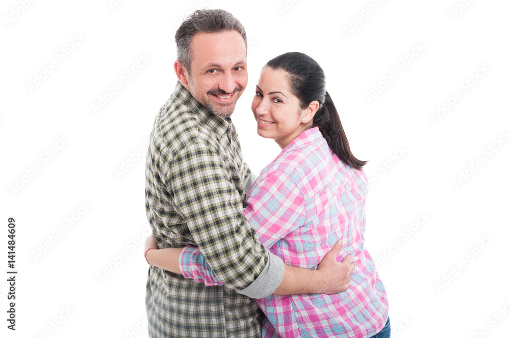 Happy young couple embracing and smiling Happy young couple embracing and smiling