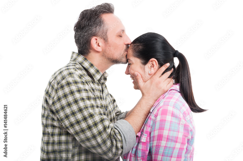 Boyfriend kissing his girlfriend on forehead Boyfriend kissing his girlfriend on forehead