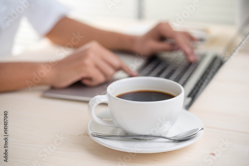 woman using laptop and coffee