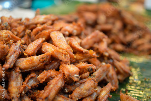 Cuts of the crispy fried fatty pork sold from the outdoors stall in the food market in Bankgok, Thailand