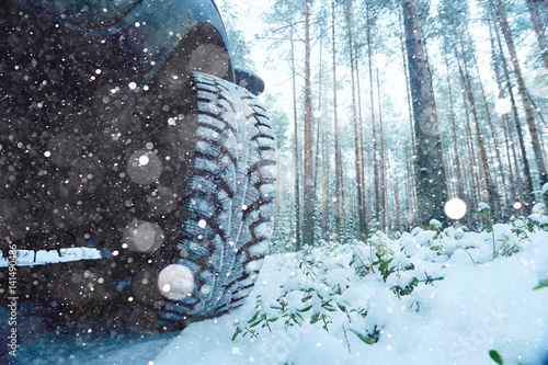 Winter car wheel studs, the concept of winter car ride photo