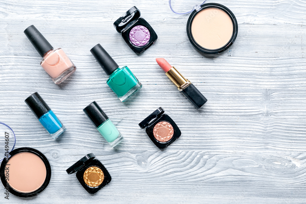 set of decorative cosmetics on wooden table background top view mock-up set of decorative cosmetics on wooden table background top view mock-up