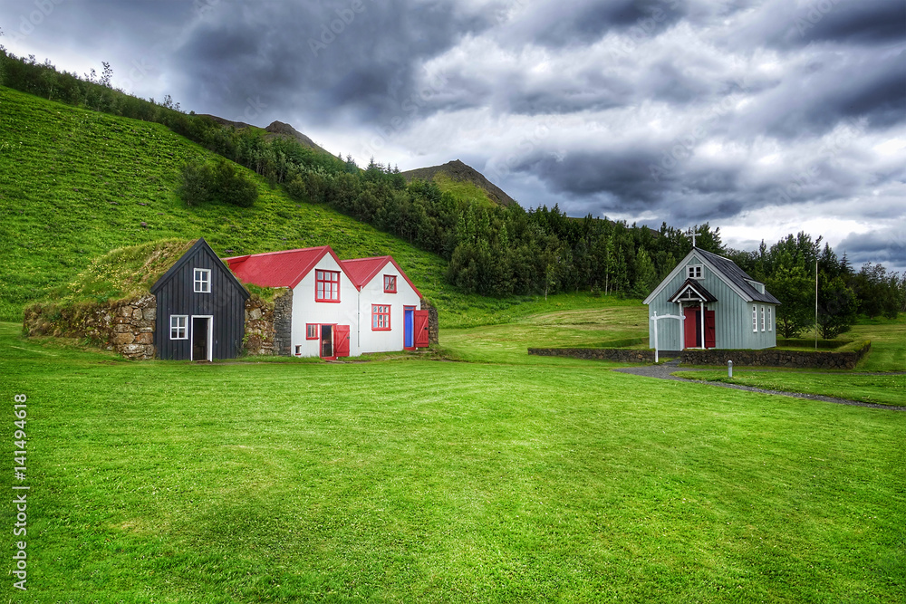 Typical small houses in Iceland. Old architecture with grassy roof.