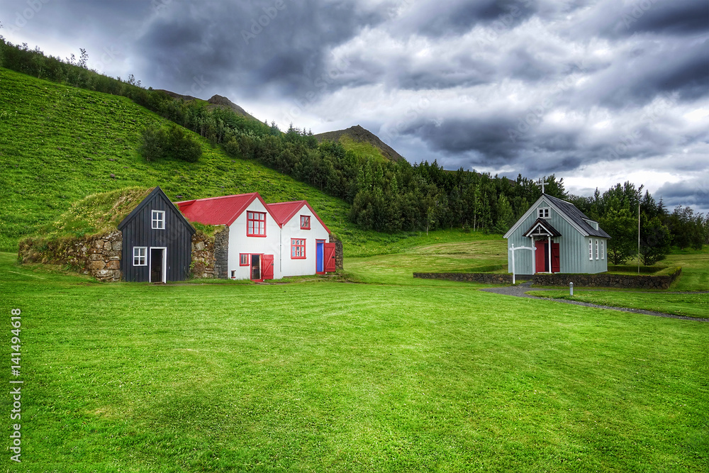 Typical small houses in Iceland. Old architecture with grassy roof. Typical small houses in Iceland. Old architecture with grassy roof.