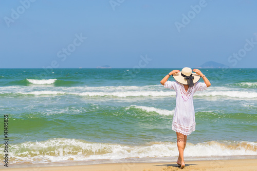 Woman relaxing at the beach in Hoi An
