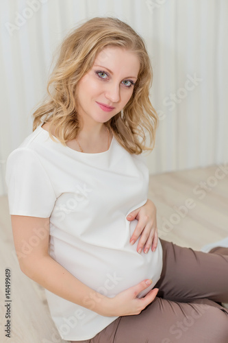 Beautiful pregnant girl waiting for the baby