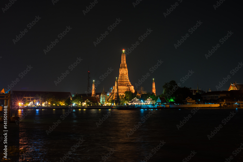 Night scene view of Wat Arun (Temple) across Chao Phraya River