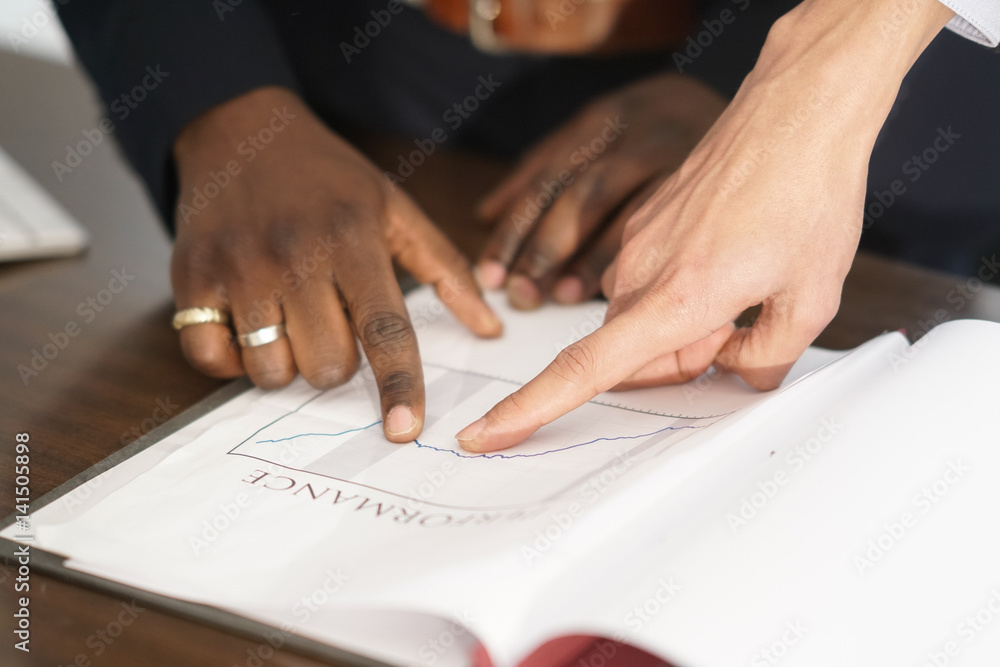 Human hands examining financial paperworks and financial documents Human hands examining financial paperworks and financial documents