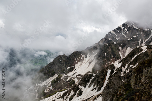 Big clouds over the snow-capped mountain peaks,Caucasus