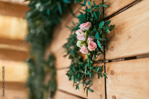 Romantic background with pink roses on wood planks