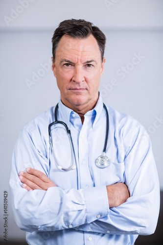 Portrait of confident doctor standing with arms crossed © WavebreakMediaMicro