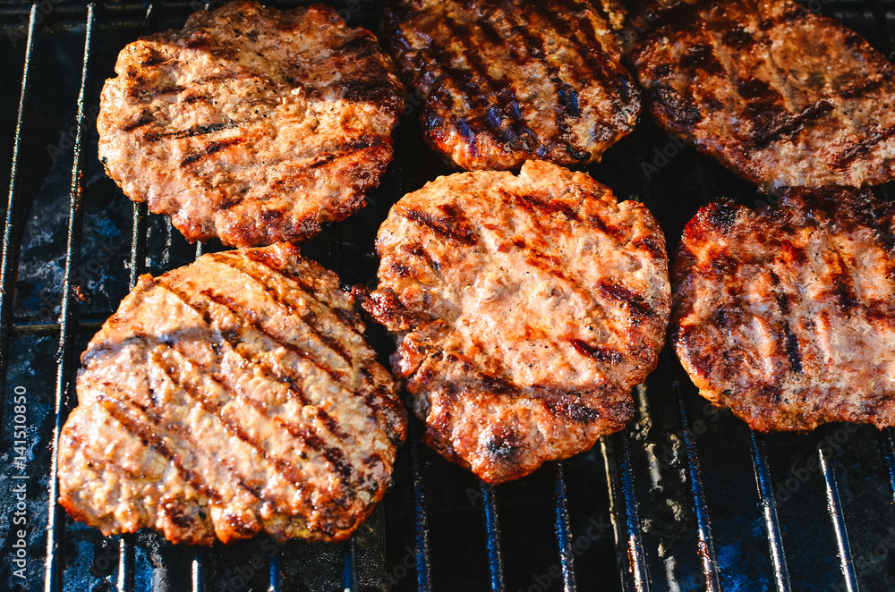 Cooking hamburgers on the grill Cooking hamburgers on the grill