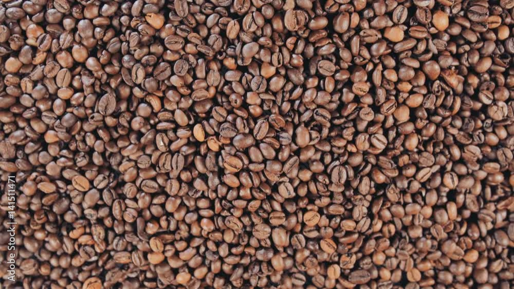Coffee beans are on the table. Rotate. Slow motion. Coffee beans are on the table. Rotate. Slow motion.