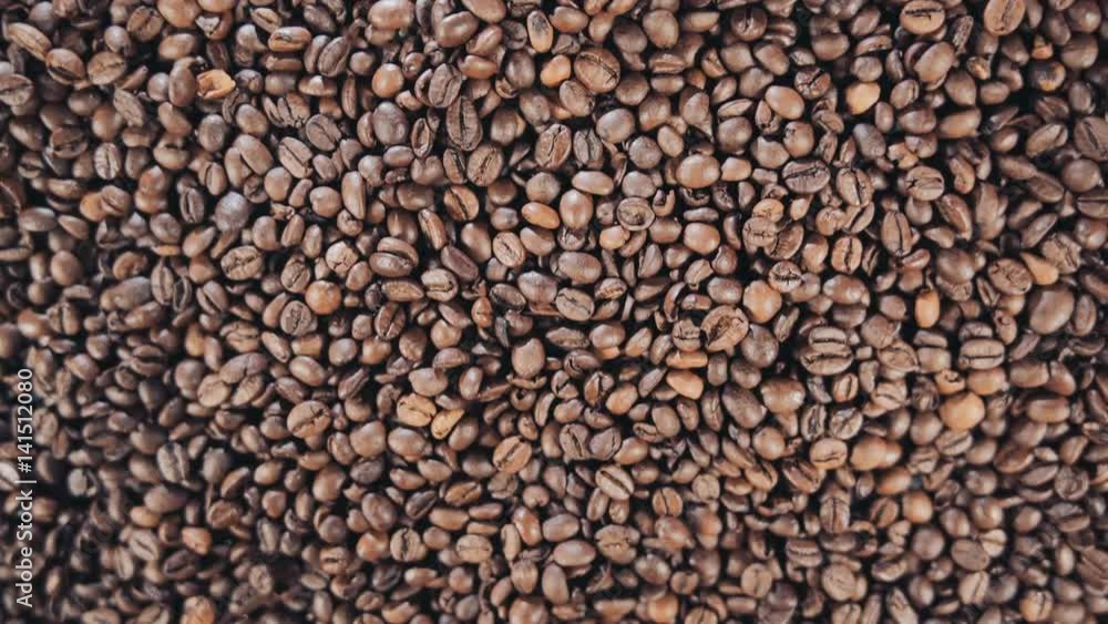 Coffee beans are on the table. Rotate. Slow motion. Coffee beans are on the table. Rotate. Slow motion.