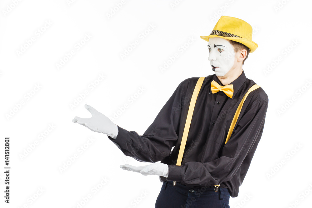 Portrait of a man, an artist, a pantomime. Shows something, isolated on white background Portrait of a man, an artist, a pantomime. Shows something, isolated on white background
