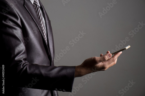 Close up of businessman playing multimedia