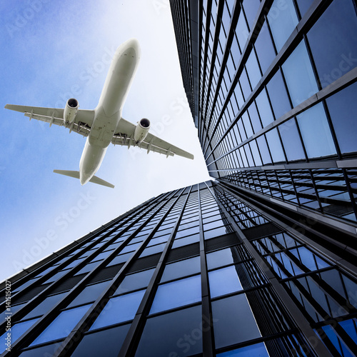 airplane with modern building. Jet over City