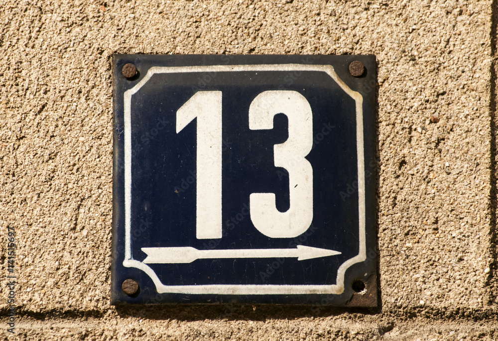 Weathered grunge square metal enameled plate of number of street address with number 13 closeup Weathered grunge square metal enameled plate of number of street address with number 13 closeup