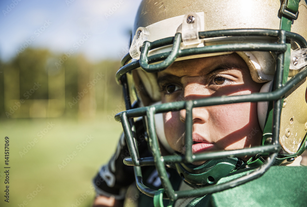 Boy (10-11) playing american football Boy (10-11) playing american football
