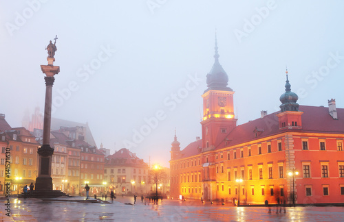 Smog in winter Warsaw old town. Foggy cold evening of February 2017. Central square with royall palace, Sigismund's Column photo