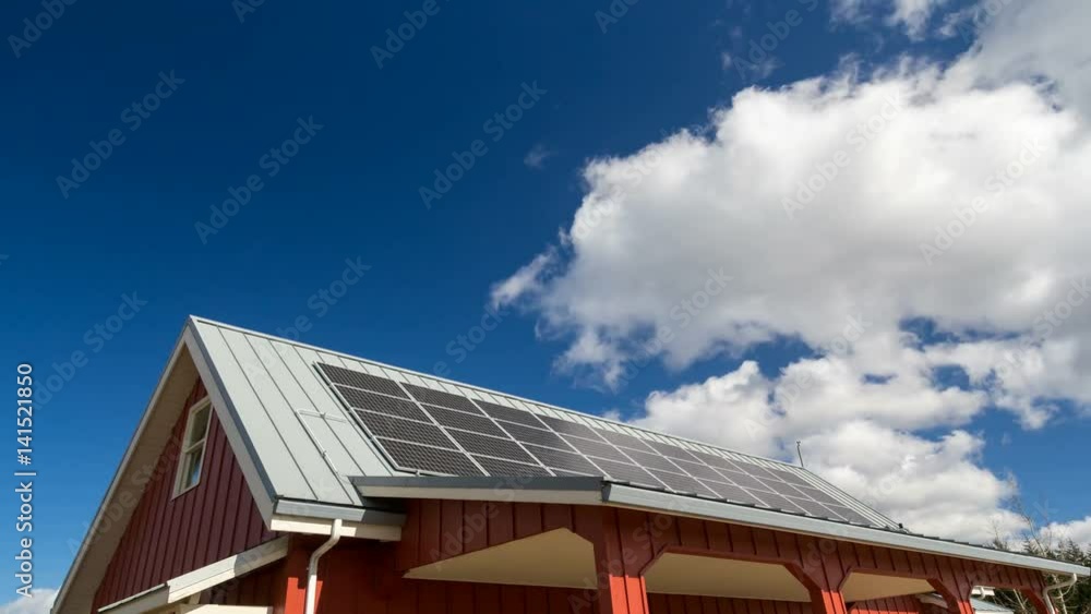 Ultra high definition 4k time lapse movie of moving white clouds and blue sky over rooftop with solar panels installed 4096x2304 uhd Ultra high definition 4k time lapse movie of moving white clouds and blue sky over rooftop with solar panels installed 4096x2304 uhd