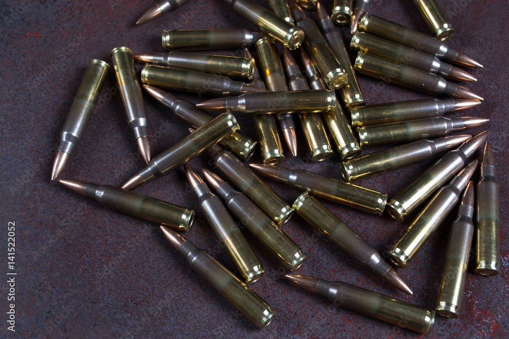 Group of ammunition on a rusted metal background Group of ammunition on a rusted metal background