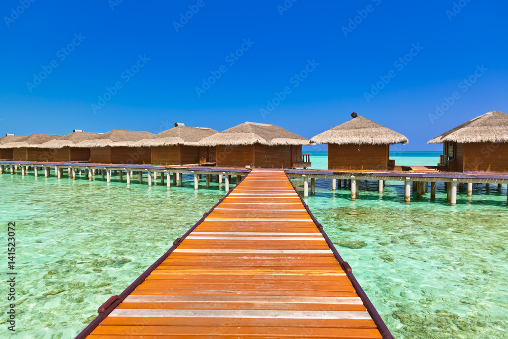 Water bungalows on tropical Maldives island Water bungalows on tropical Maldives island