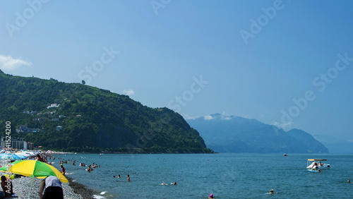 Holidaymakers on the beach of the sea photo