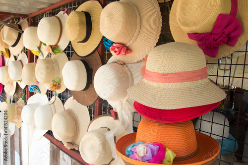 Group of hat for summer, beach vacation hang on the rack