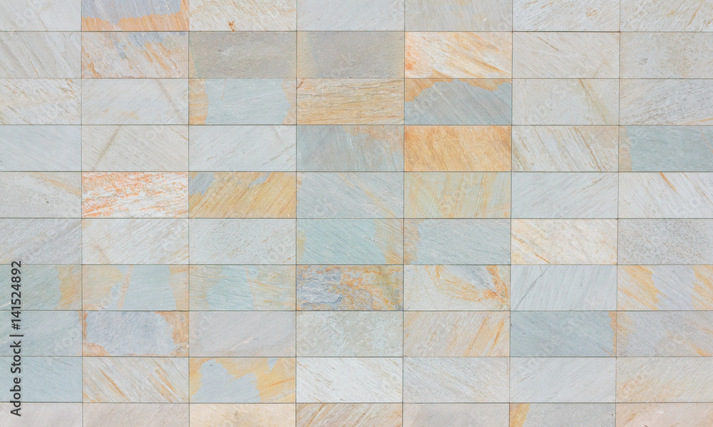 Texture of beige and gray tile on a facade of modern building Texture of beige and gray tile on a facade of modern building